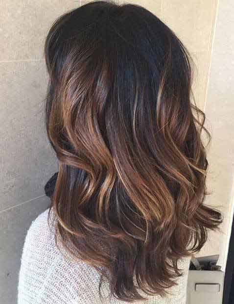 Black base color with caramel low lights | Hair Mag